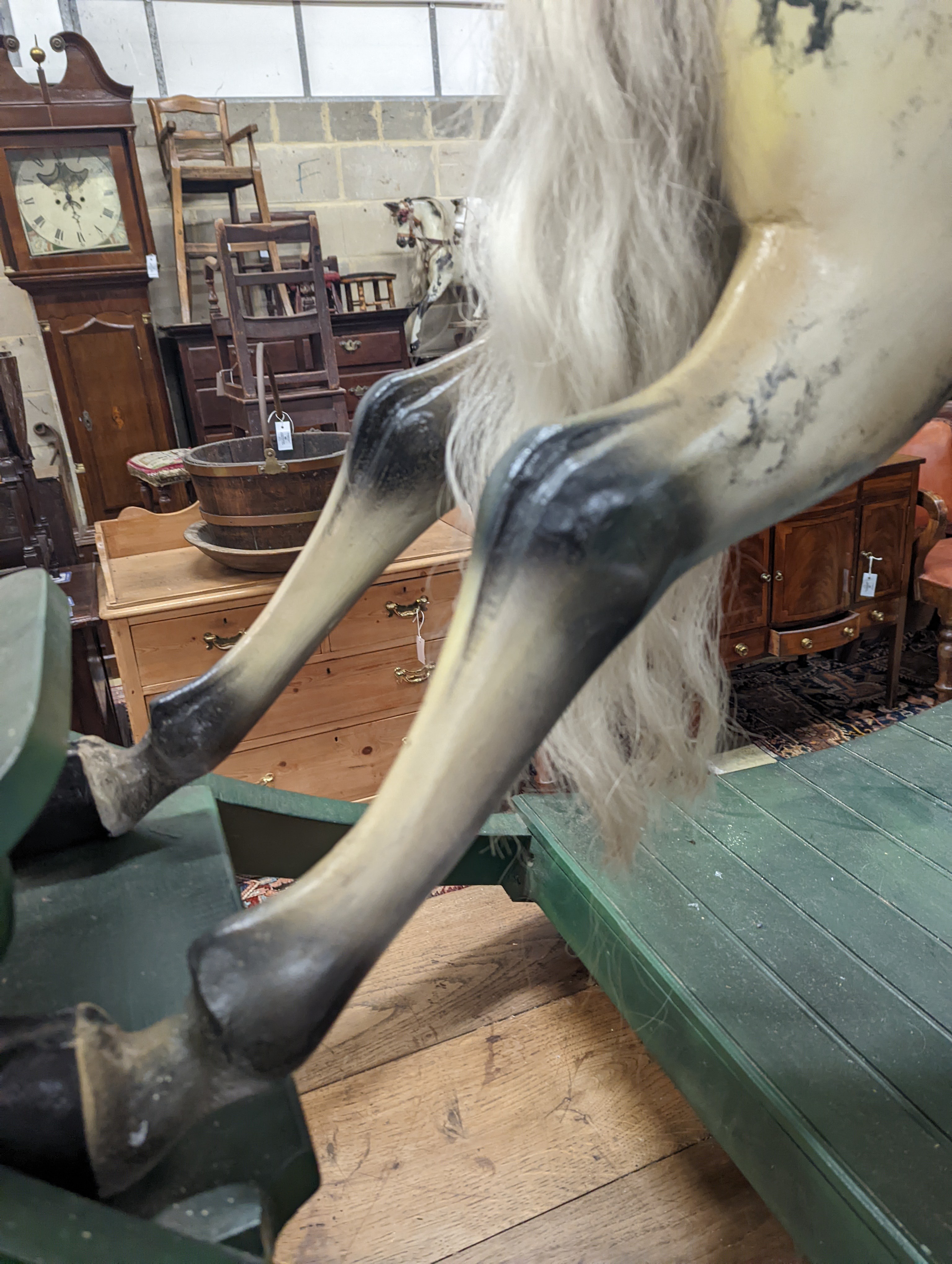 A large Victorian style painted rocking horse with end seats, length 240cm, height 132cm